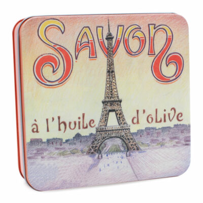 Boite en metal vintage illustrée par un dessin representant une tour. La boite contient 4 savons de 100g chacun á la rose